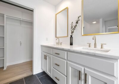 Custom dual vanity bathroom remodel with gold accents in Treasure Coast home