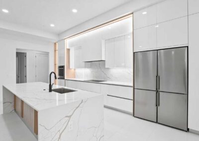 Sleek modern kitchen with quartz countertops in a custom home in Vero Beach.