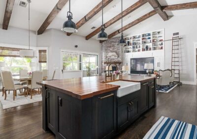 Rustic farmhouse kitchen remodel with exposed beams and wood island in Sebastian, Florida
