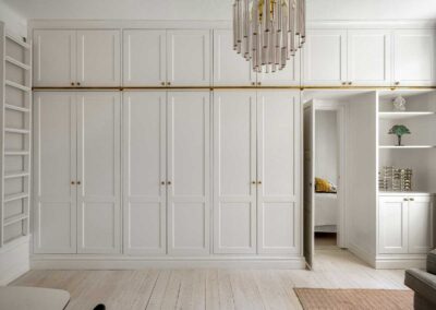 Luxury walk-in closet remodel with modern storage and custom lighting