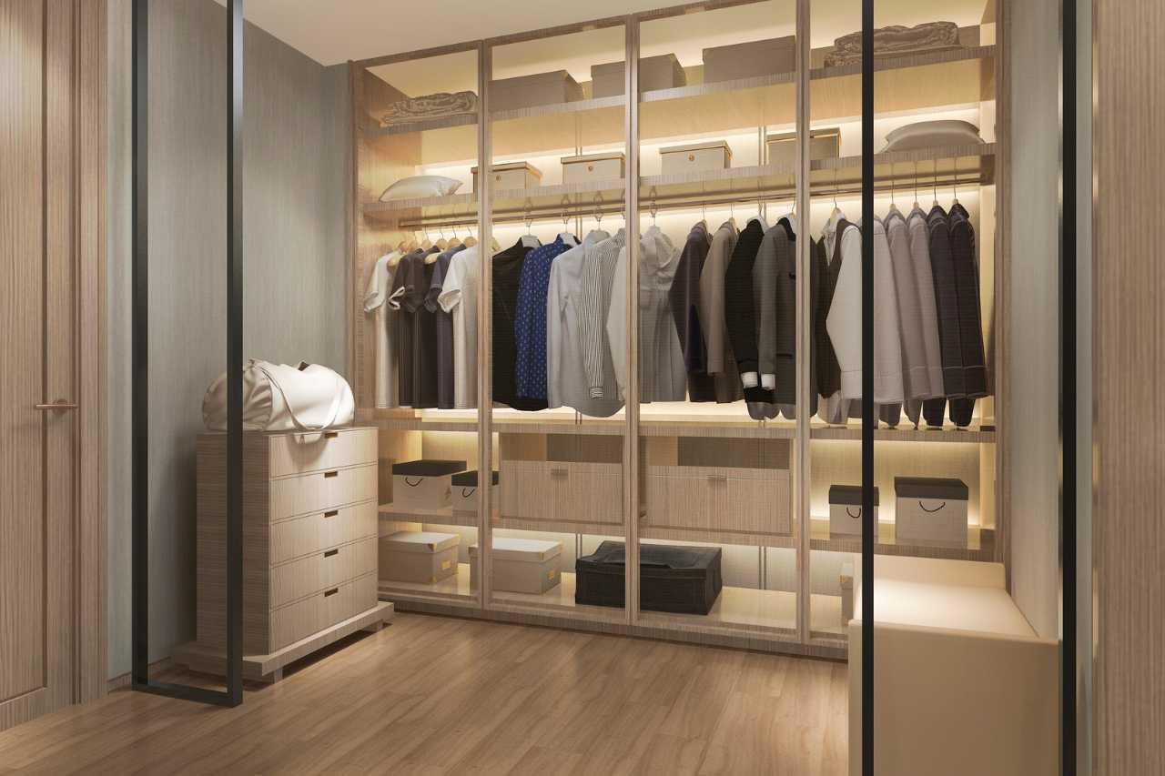 Modern custom closet remodel with wood cabinetry and shelving”