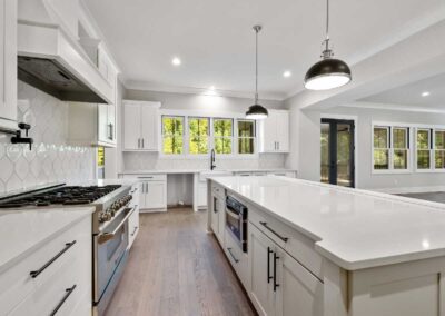 Open-concept kitchen remodel with long quartz island and natural light in Sebastian, Florida